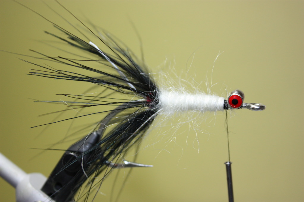 Wrap the yarn up the hook shank to create a body