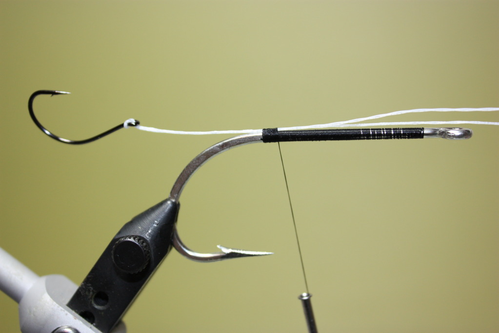 Take a length of Fireline and form a loop.  Thread the loop through the eye of your stinger hook.  Attach the Fireline above above the hook point.  (NOTE: Make sure you make your loop long enough to remove the stinger hook.  This will allow you to change 