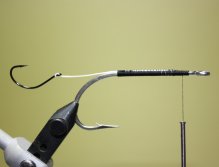 Bind down the Fireline. (Optional: Apply brushable superglue to the shank of the hook)