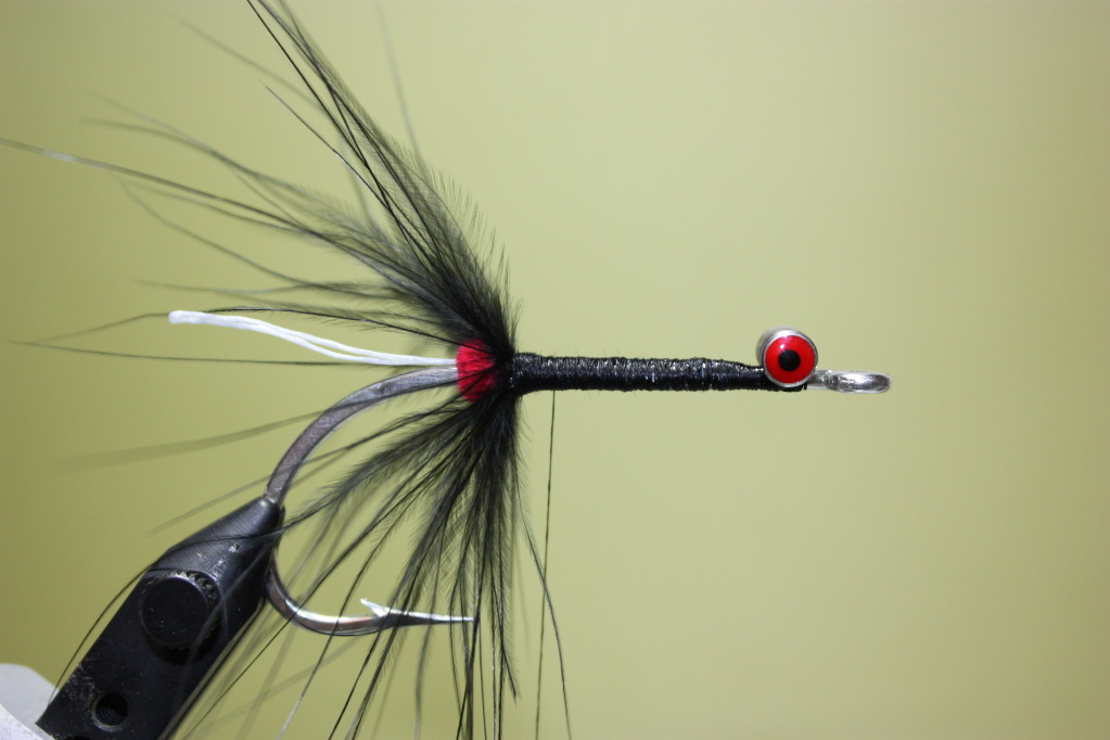 Tie in a piece of marabou by the tip.  Fold back the fibers and wrap.  Tie off