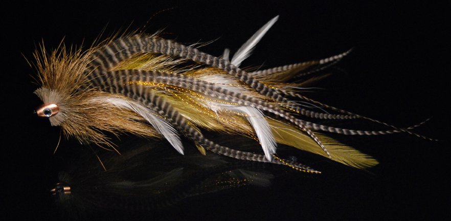 This is another replot stinger mack (II) tied with red and white raccoon fur, white Chinese  cock saddles & hot orange microbarb saddles