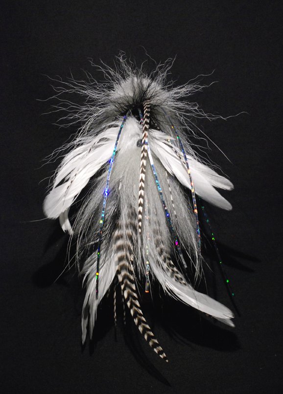 This one is a plain white and black pattern tied with white Chinese cock saddles, White and  black bucktail,grizzlt microbarb saddles and a tightly packed white and black spun deer hair  head