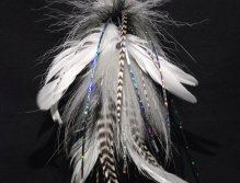 This one is a plain white and black pattern tied with white Chinese cock saddles, White and black bucktail,grizzlt microbarb saddles and a tightly packed white and black spun deer hair head
