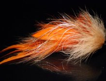 This is a combination of Orange schlappen, hot orange grizzly microbarb saddles,Tan floss Fibre and tan marabou hairline feathers