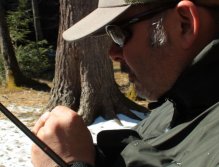 Aaron ties on a fly in a segment before starting his on stream illustrations