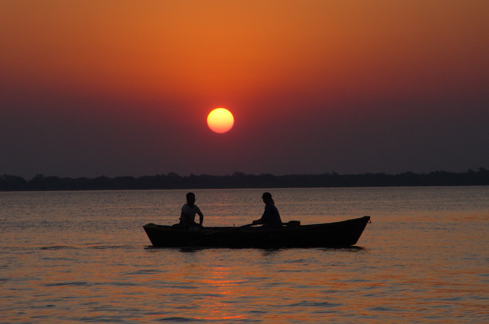 Two canoeists figuring out what fly fishers do