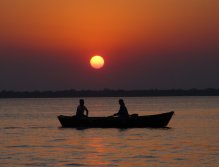 Two canoeists figuring out what fly fishers do