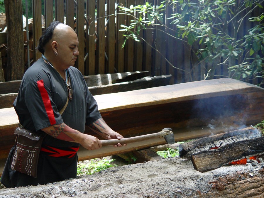 Usquetsiwo, (Cherokee Indian Sonny Ledford) making a dug out canoe from a large yellow poplar tree