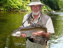 Author holding a beautiful rainbow trout caught in Raven's Fork