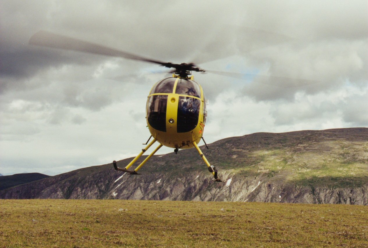 Chopper dropping people for mountain hike