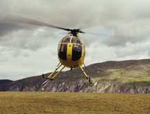 Chopper dropping people for mountain hike