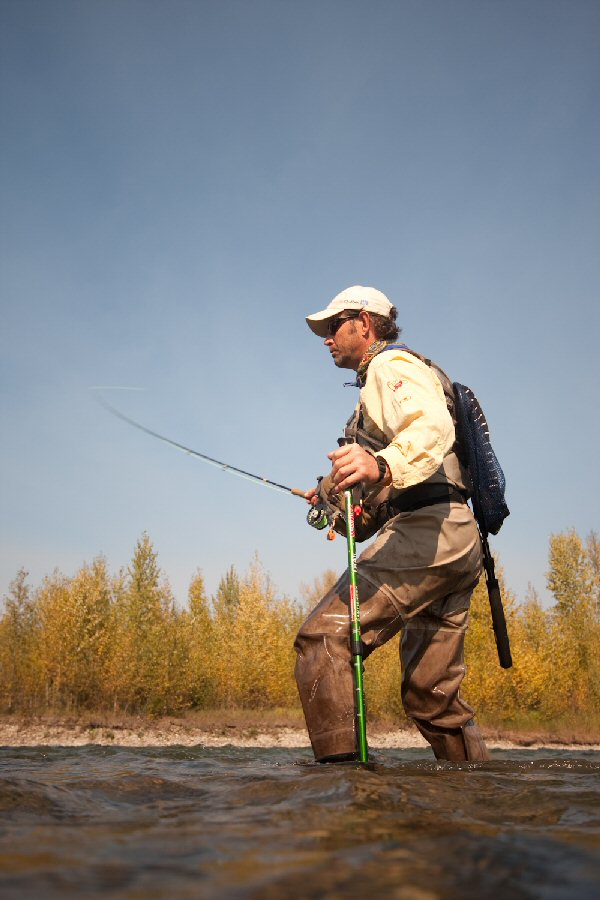 Working across the Elk with wading staff