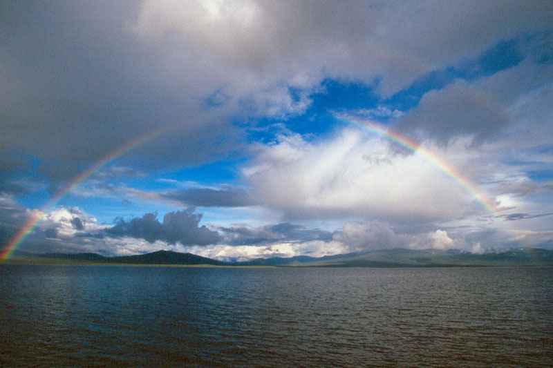 Entire rainbow over Wolf Lake ,Yukon, Canada