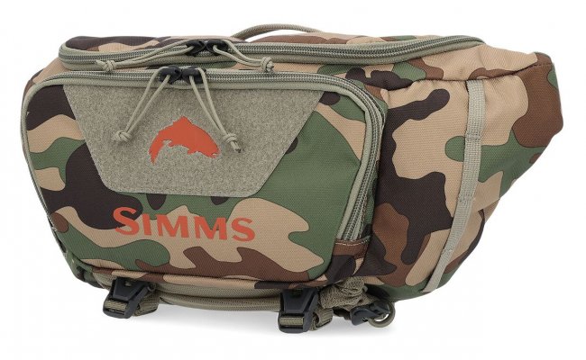 Mu�ka�sk� ledvinka Simms Tributary Hip Pack Woodland Camo Mu�ka�sk� ledvinka Simms Tributary Hip Pack Woodland Camo